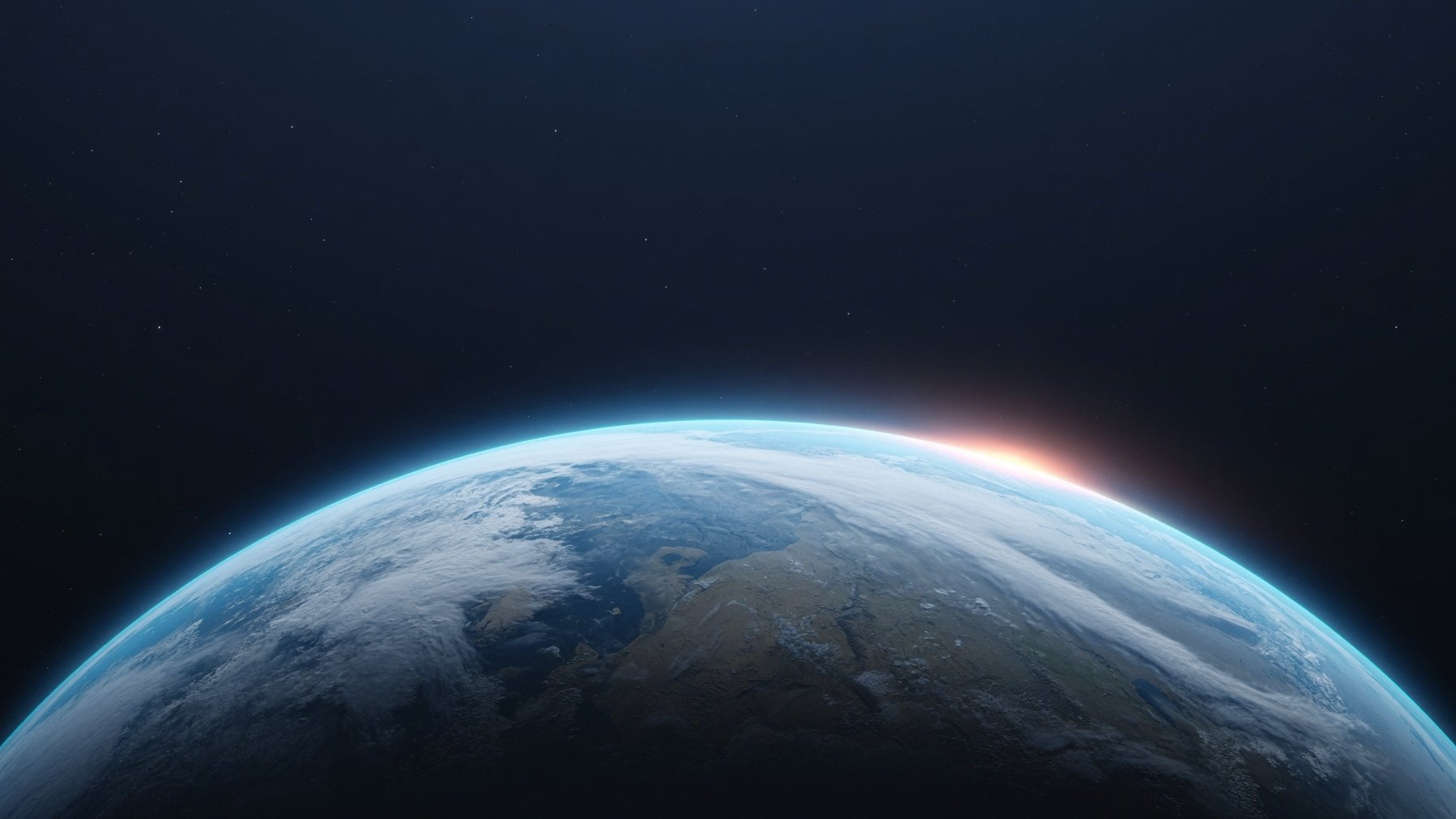 The sweeping curve of planet Earth at dawn, with a fine blue atmosphere against a quiet field of stars.